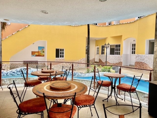 Hotel Katarma courtyard terrace with pool and dining area