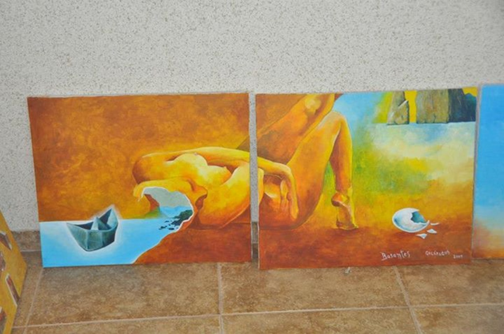 Two surrealist paintings in warm orange tones with Galápagos imagery